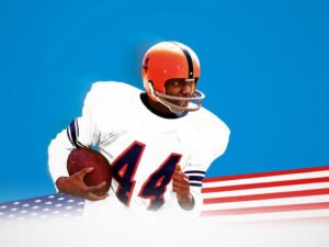 Cena emocionante do filme Ernie Davis superando preconceitos